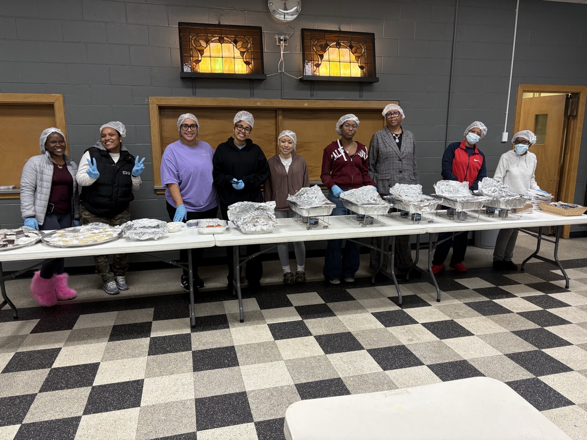 Volunteers preparing meals in the kitchen